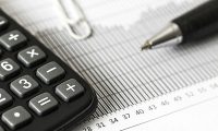 pexels-photo-209224-209224 Close-up of a calculator and pen on a bar graph, representing finance and accounting.